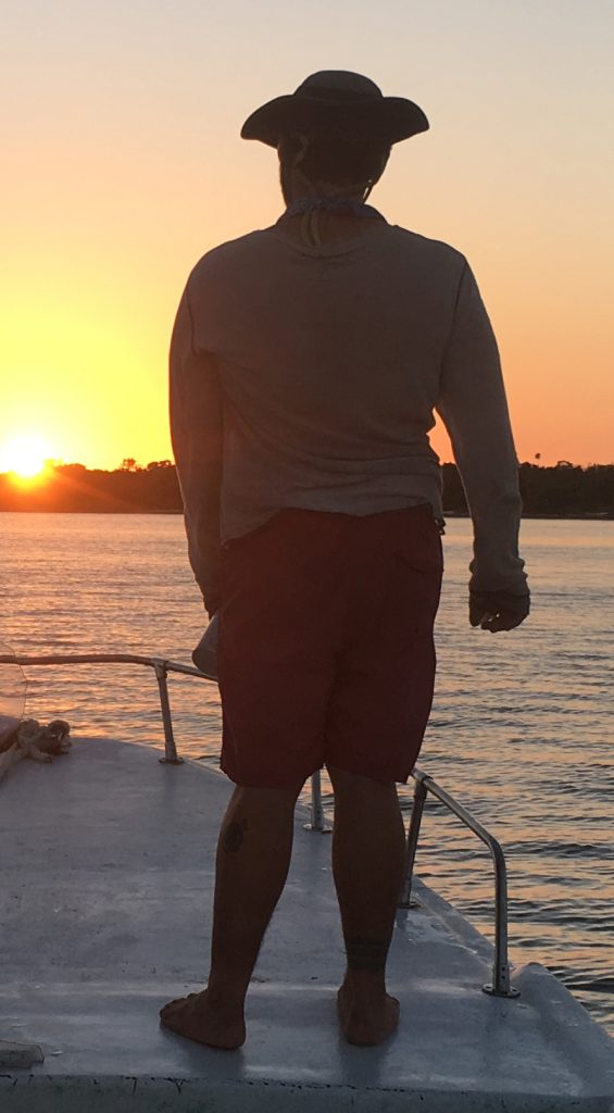 Eric Ramos contemplating the sunset in Belize